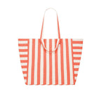 Grand sac cabas en tissu à rayures orange et blanches avec double anse dont une longue anse et une courte pour le porter sur l'épaule ou à la main, présenté sur fond clair.

