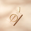 Barrette à cheveux ronde dorée